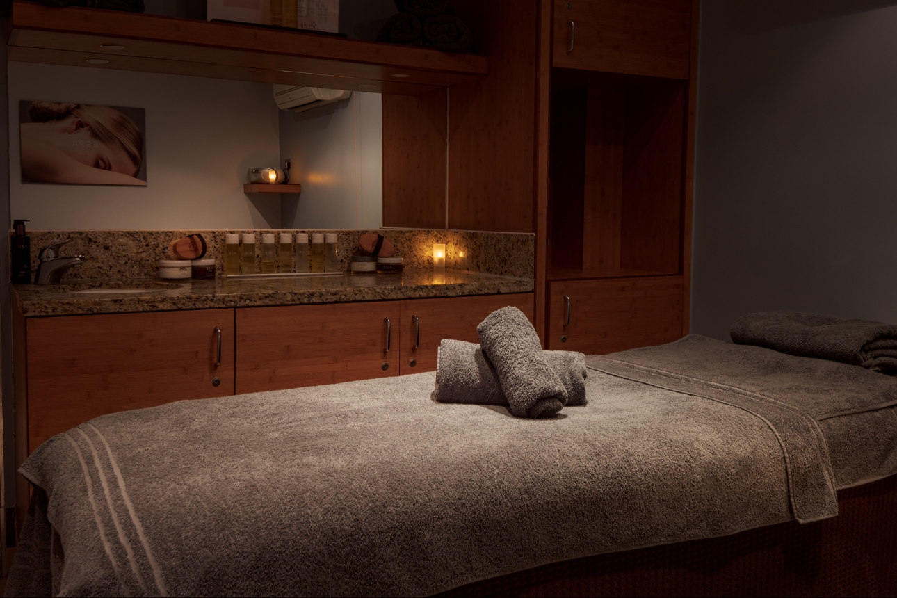 spa room with a counter and a bed