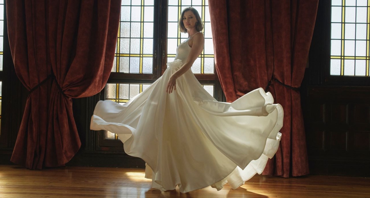 bride with princess dress on with skirts flowing up in air