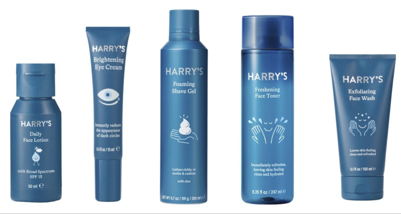 A collection of blue bottles and tubes of Harry's skincare